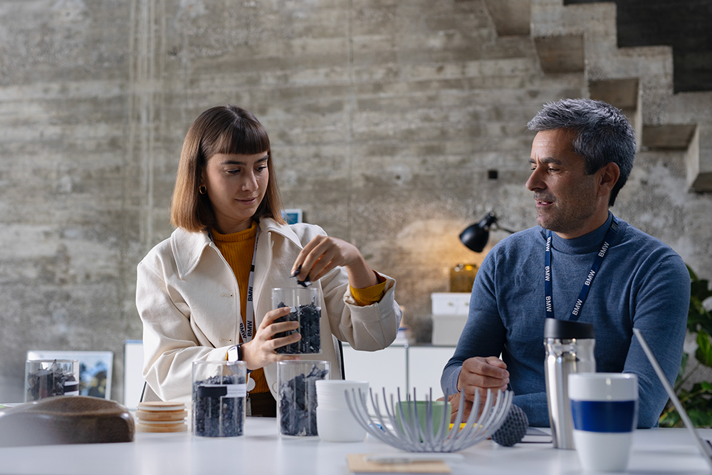 The picture shows a man and a woman with pet samples.
