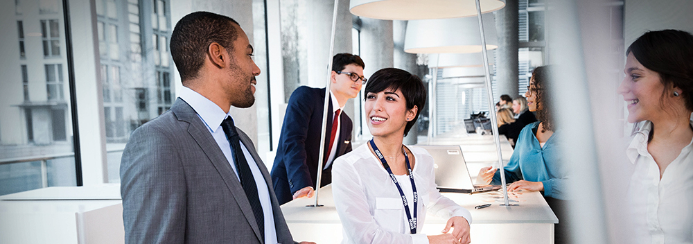 The photo shows a group of BMW professionals, having a discussion.