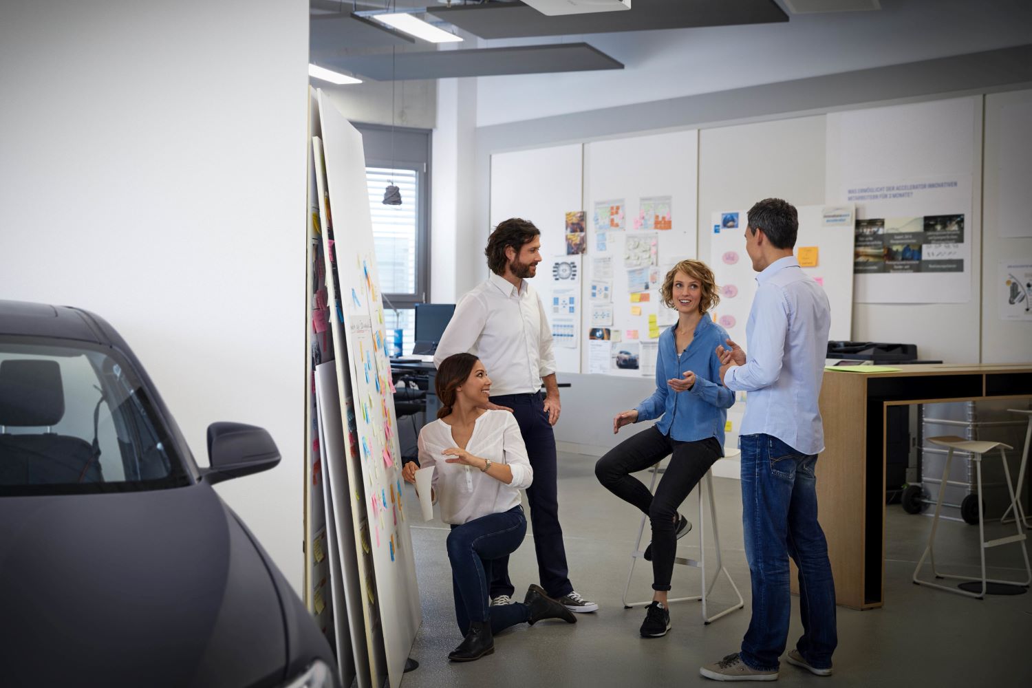 BMW employees are meeting for an IT project management appointment.