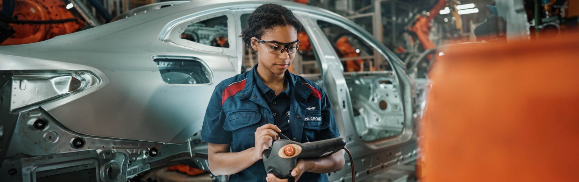 A woman who works in maintenance at work in the BMW plant.
