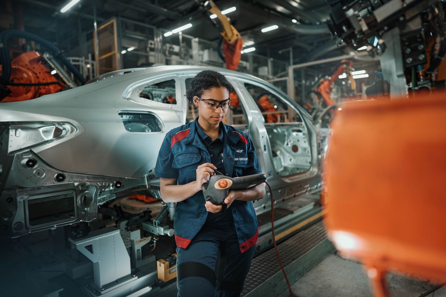 A woman who works in maintenance at work in the BMW plant.