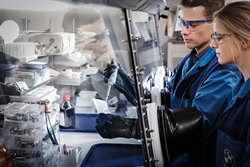 Two colleagues working in a laboratory.