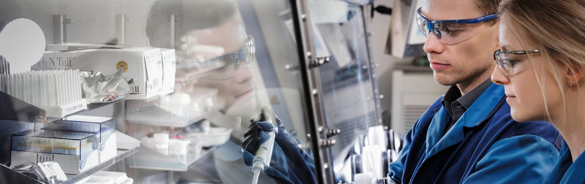 Two colleagues working in a laboratory.