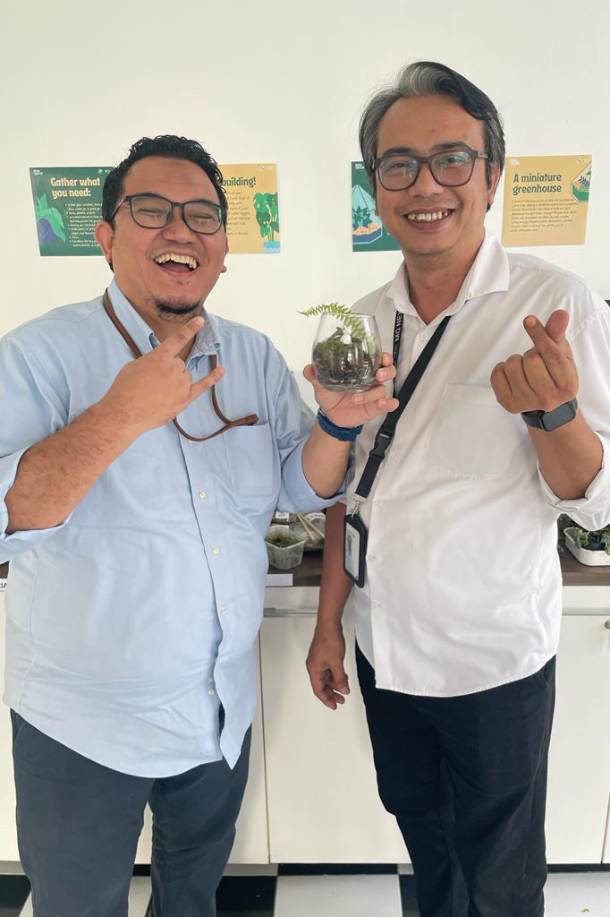 Two BMW Group Indonesia employees posing for the camera. 