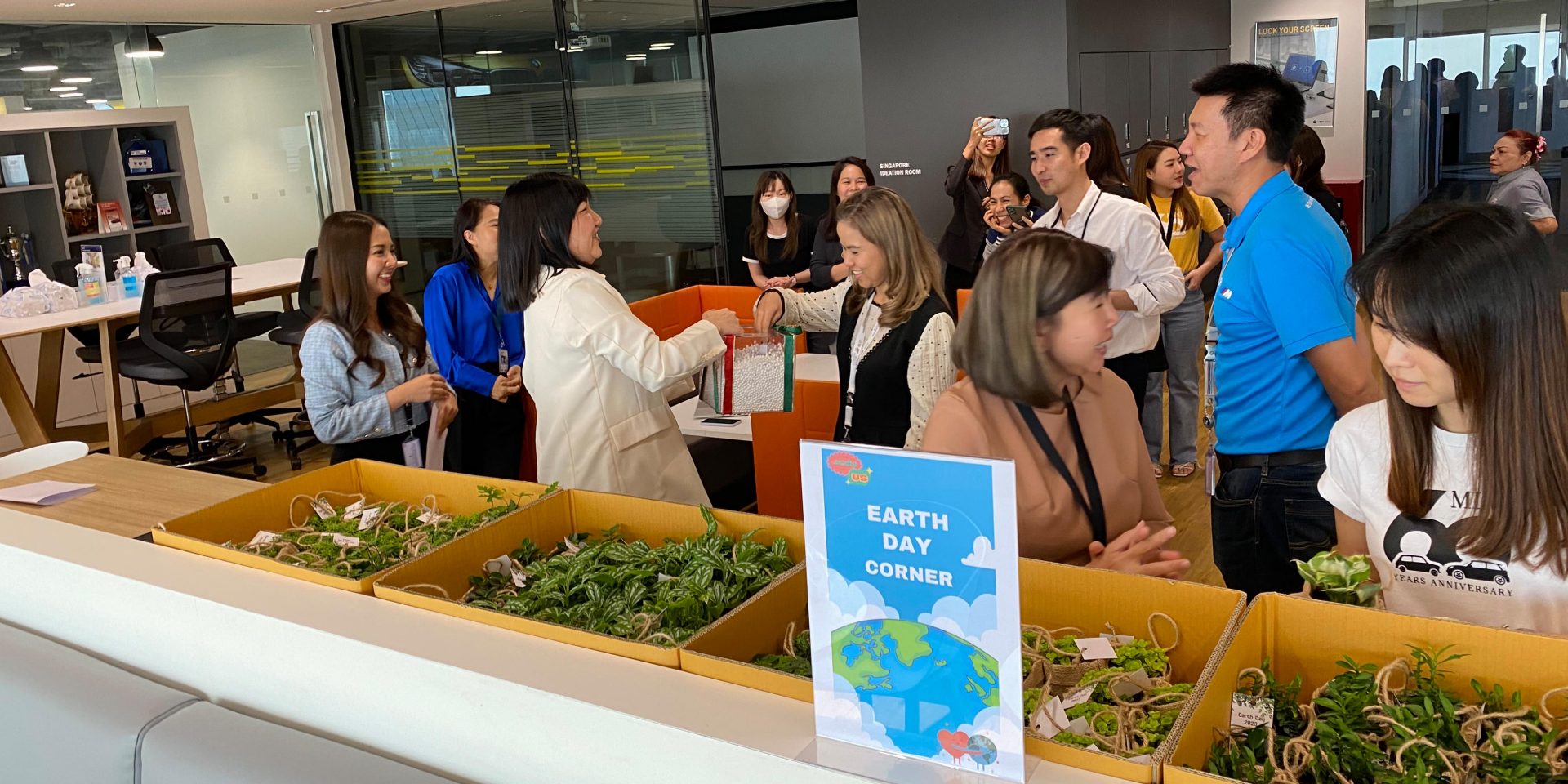 BMW Group Thailand employees discussing earth day.