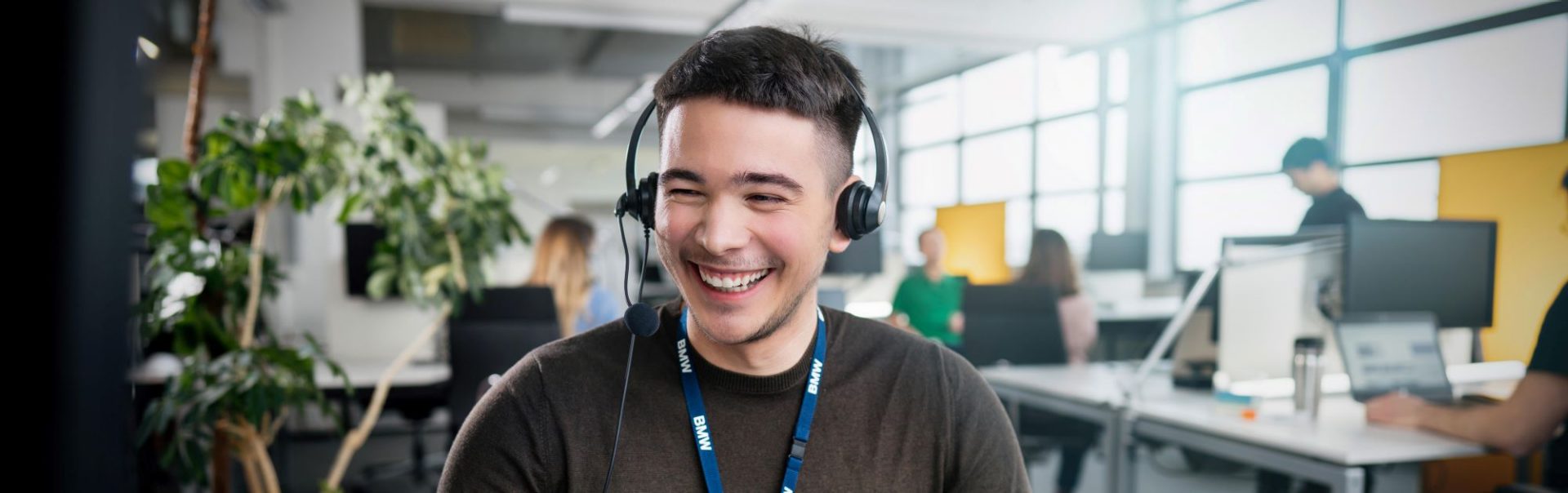 A customer services employee is talking to a customer via phone.