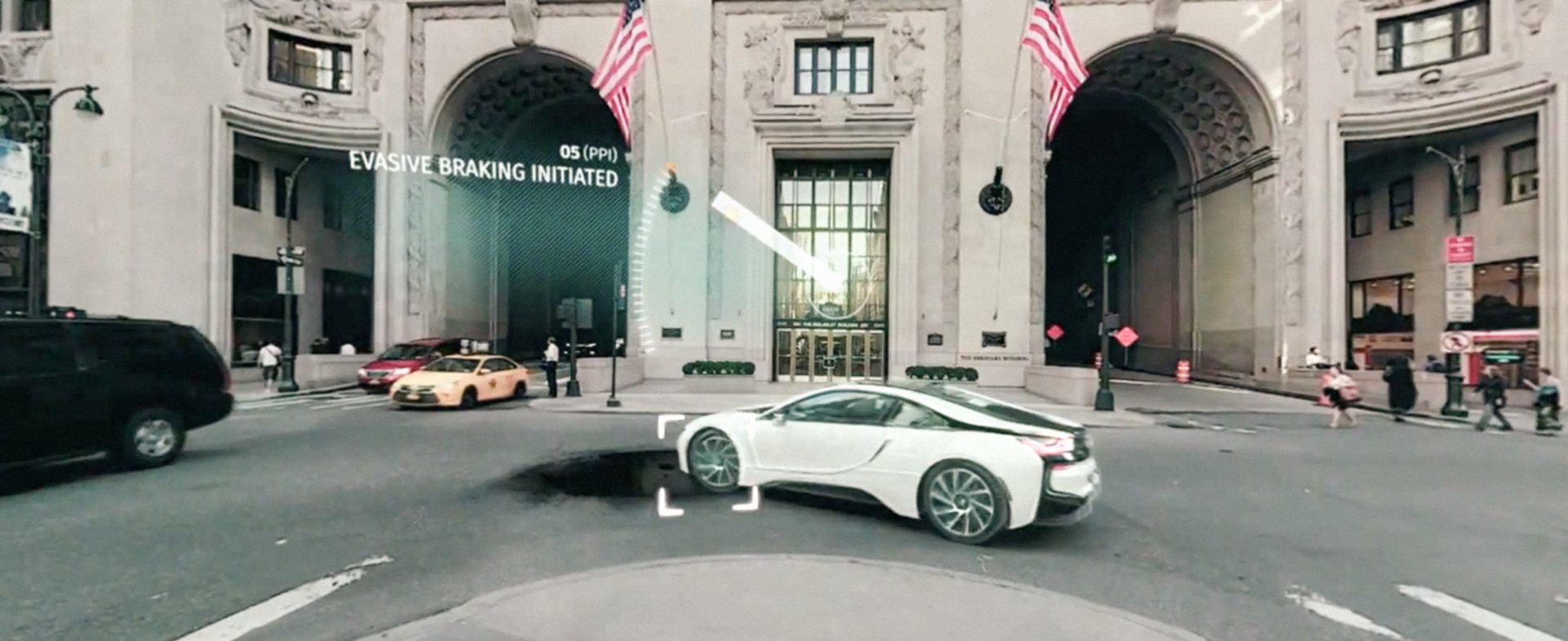 The image shows a BMW car in the city.