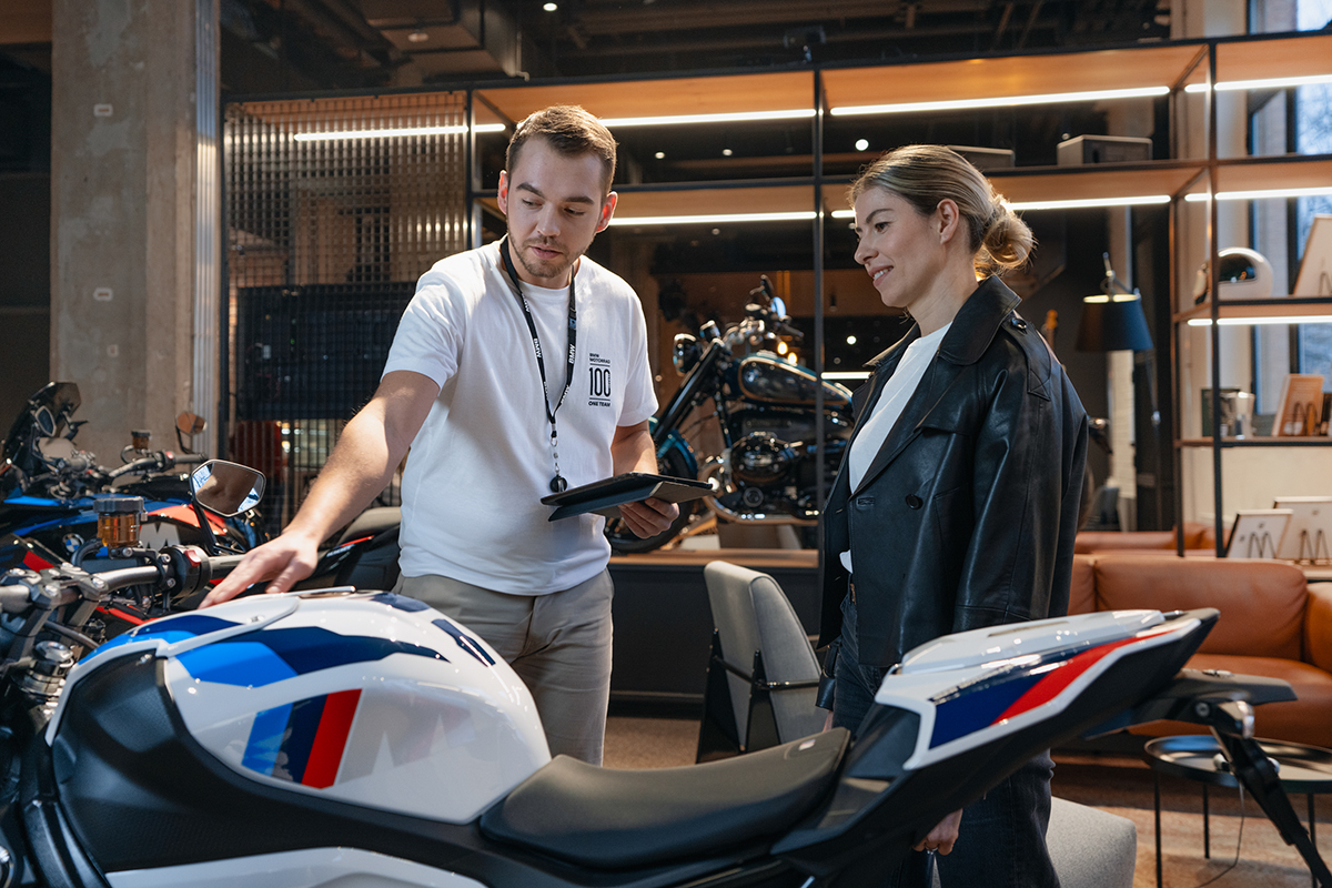 Two colleagues with a BMW motorbike