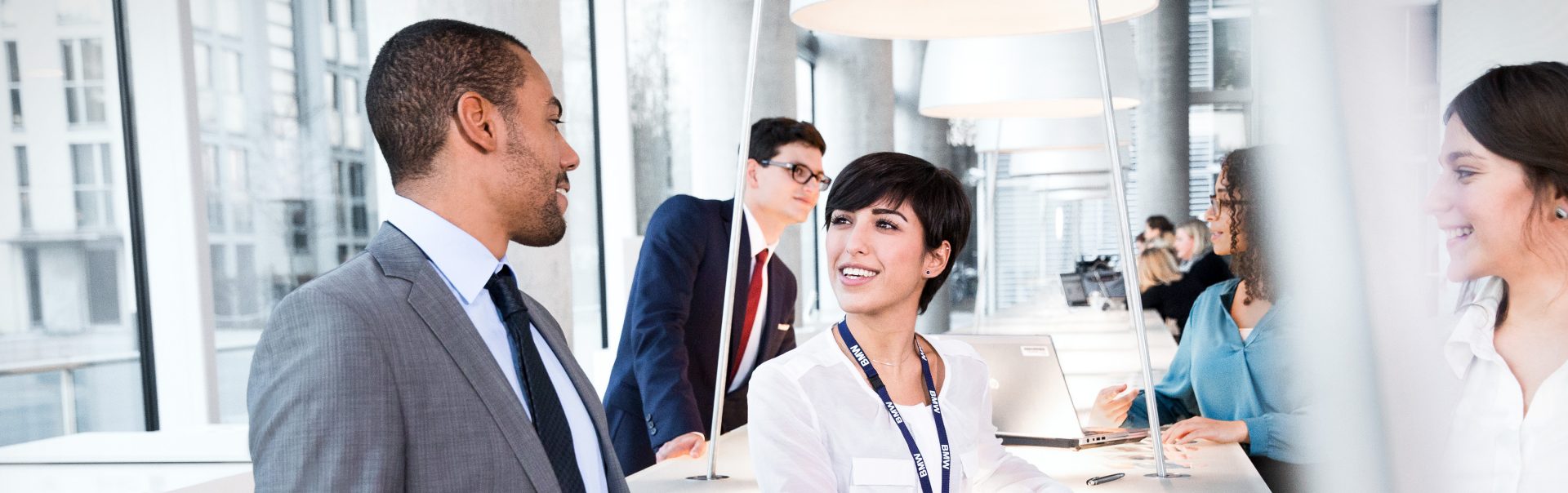 A group of BMW Group employees having a conversation.