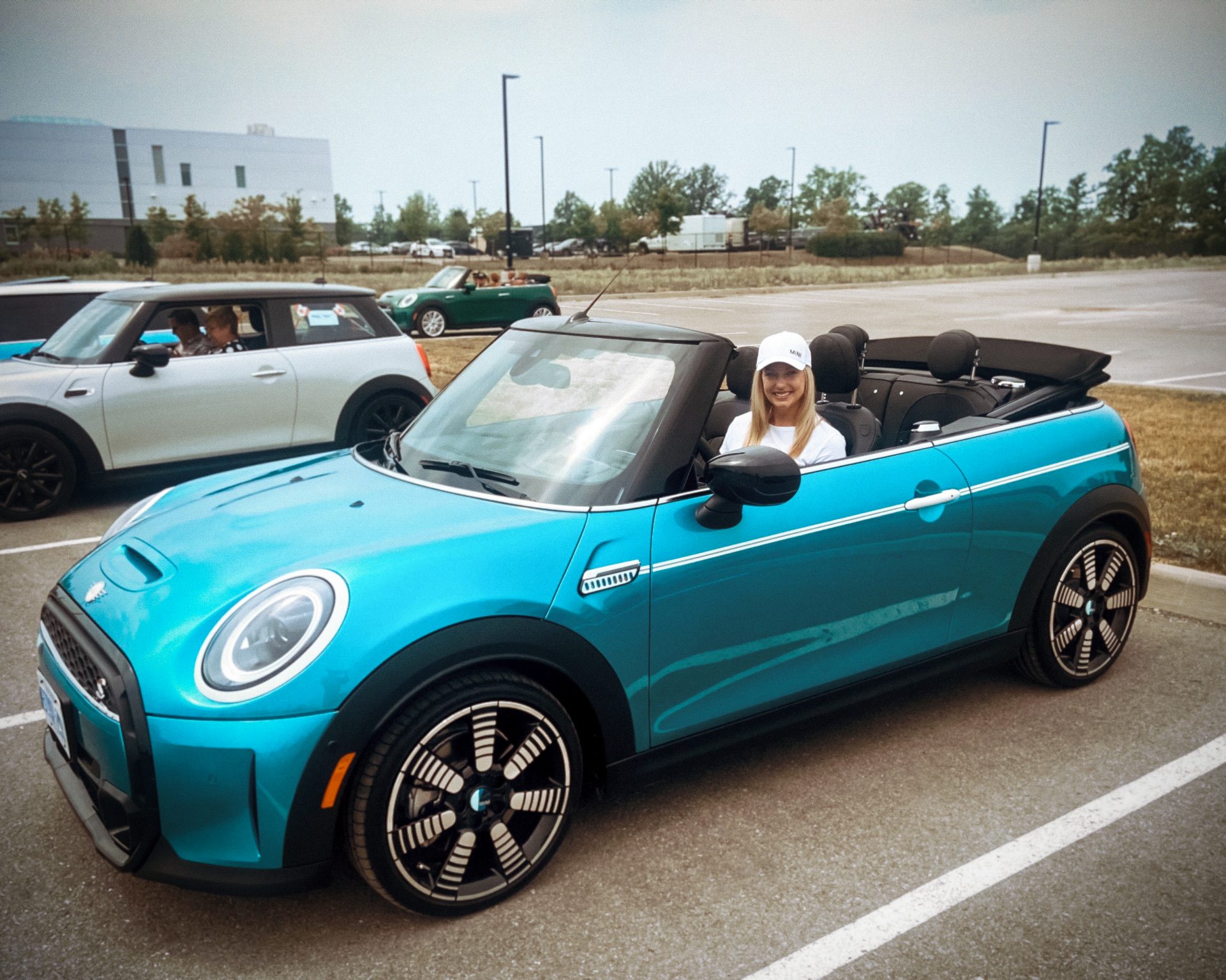BMW Group employee Alison in a blue MINI convertible