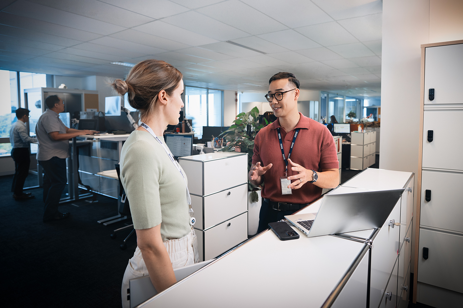 Two recent graduates having a conversation