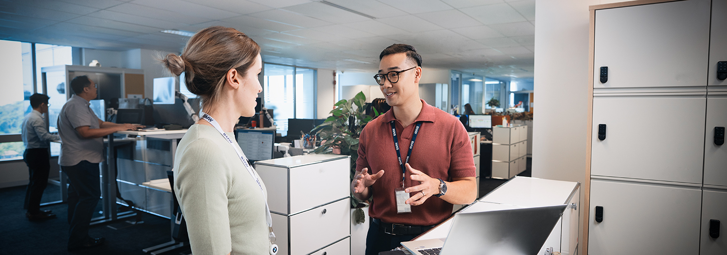 Two recent graduates having a conversation