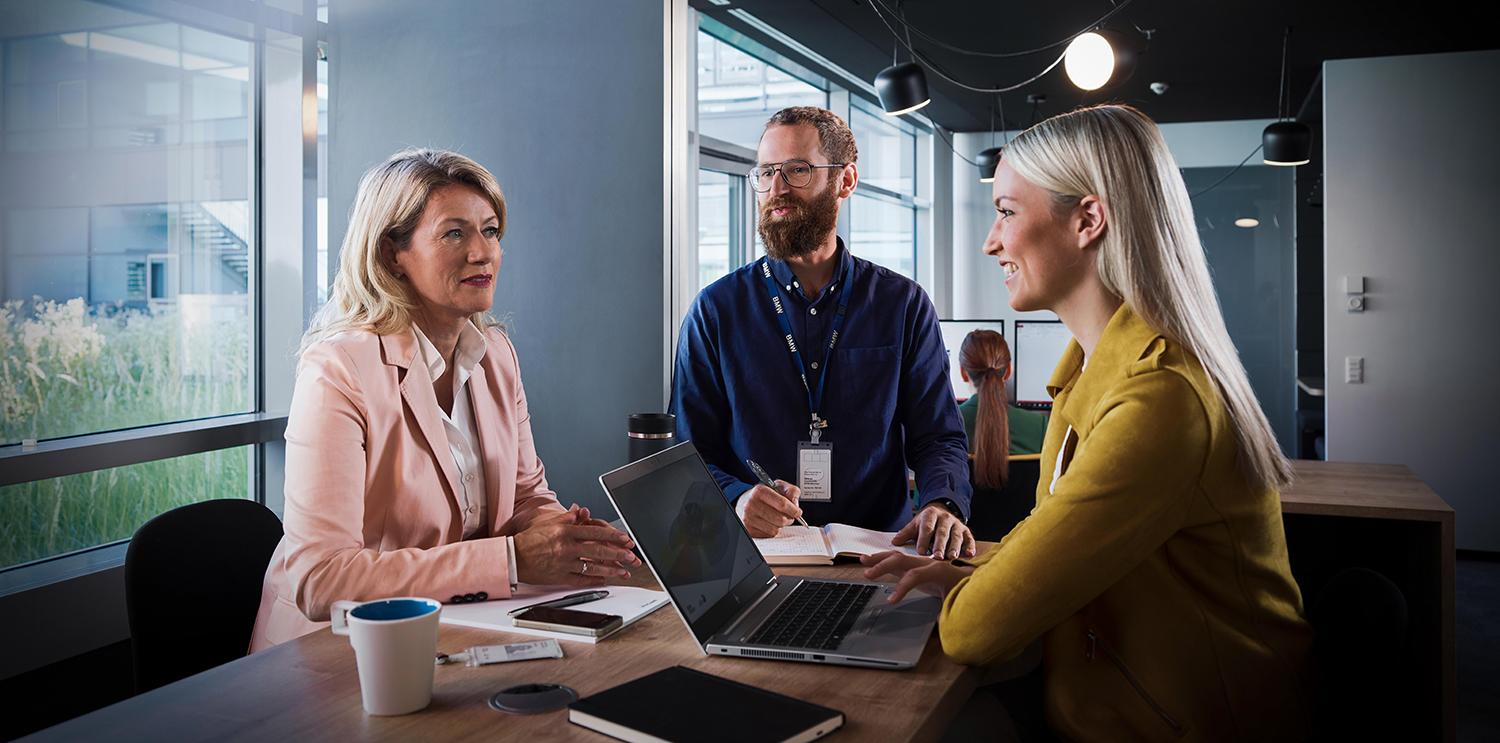 Three colleagues having a meeting