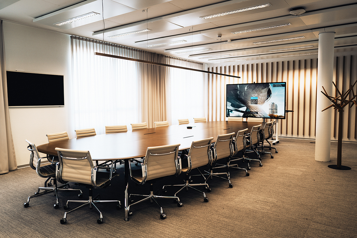 Headquarter Dielsdorf A huge meeting table inside a modern meeting room at the BMW Group location Dielsdorf.