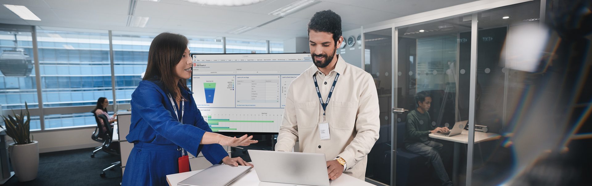 Two colleagues analyzing data on the computer