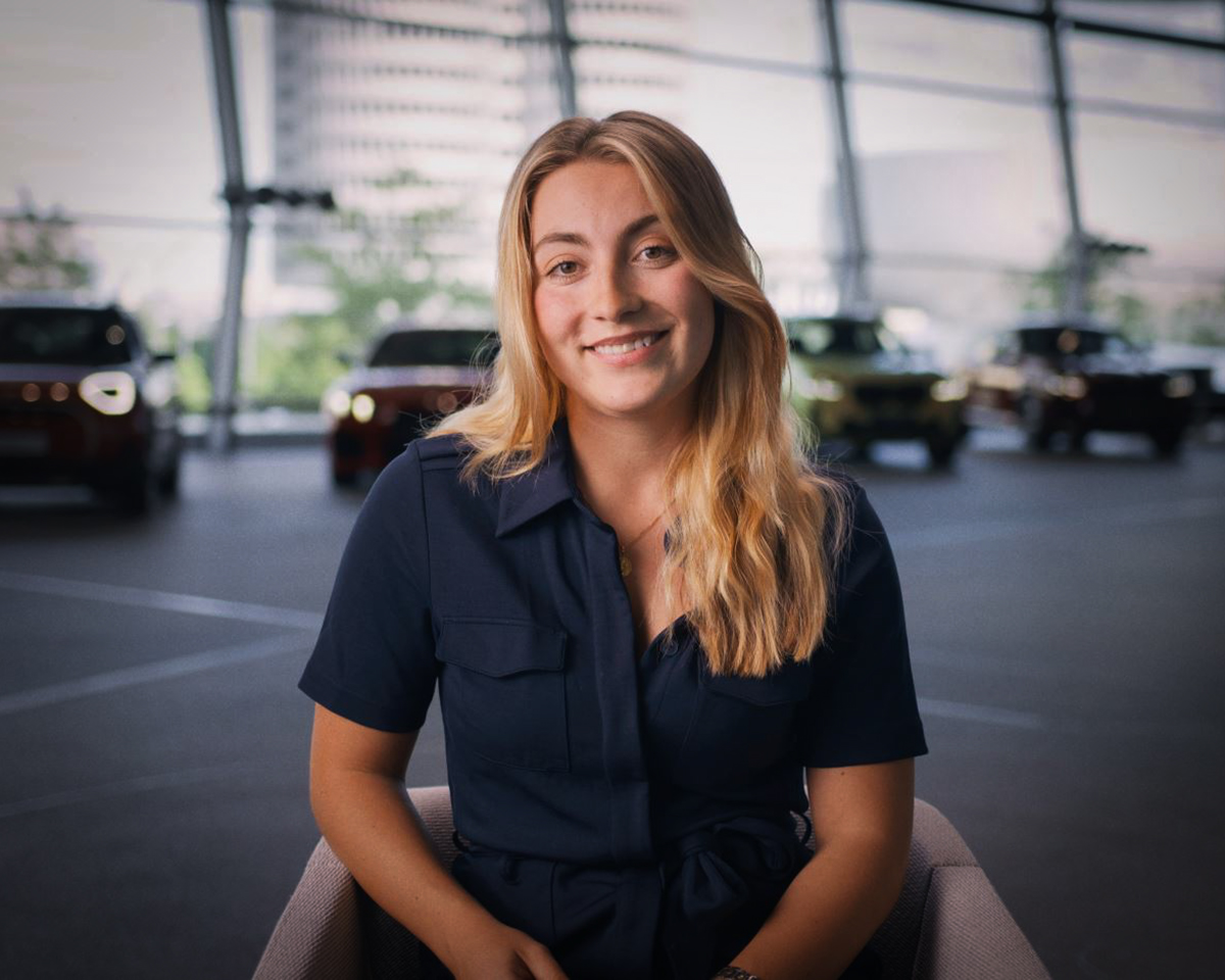 Fastlane participant Franca smiles warmly into the camera while giving an interview at BMW Welt.