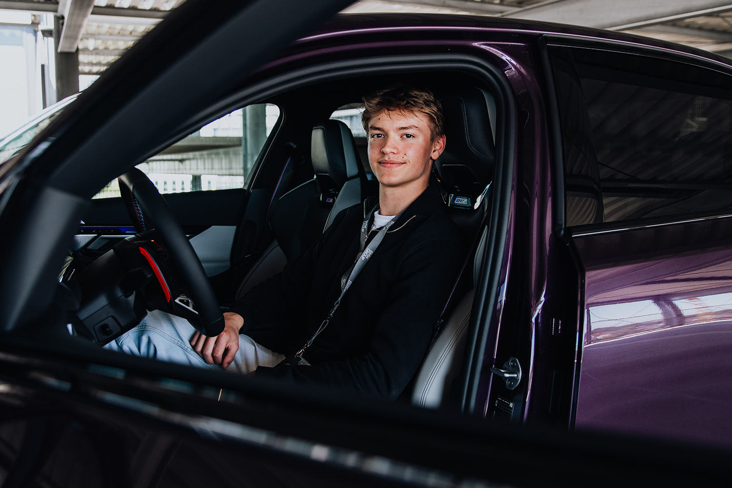 Apprentice Tobias in a purple BMW M5