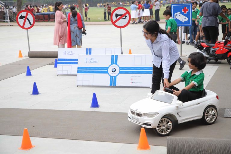 Kids receiving practical road safety training.