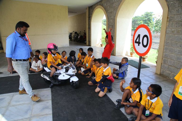 Children receiving road safety training.