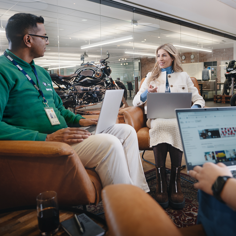 Two colleagues talking in a dealership environment