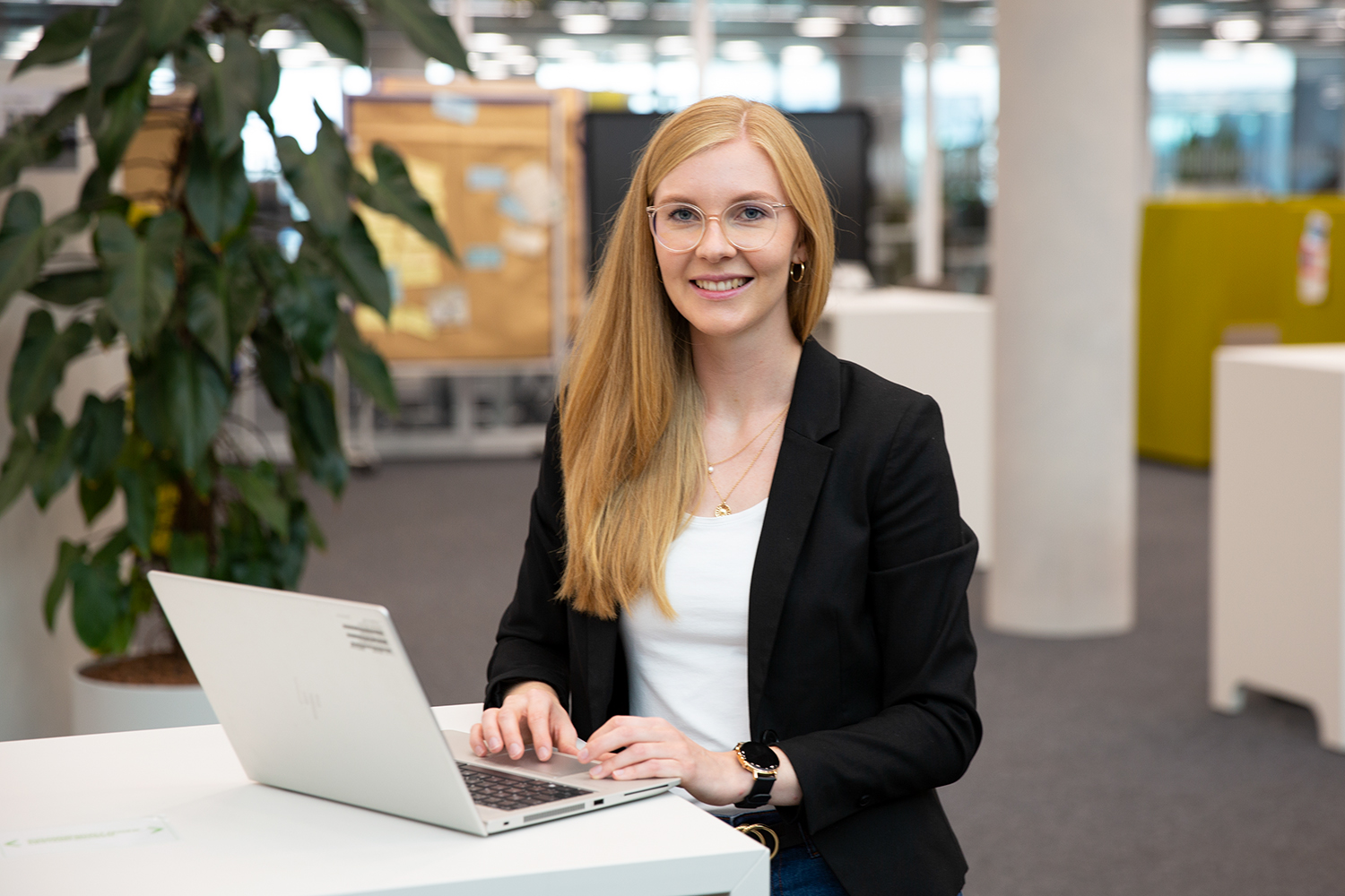 Female Trainee in Purchasing & Quality working on her computer.