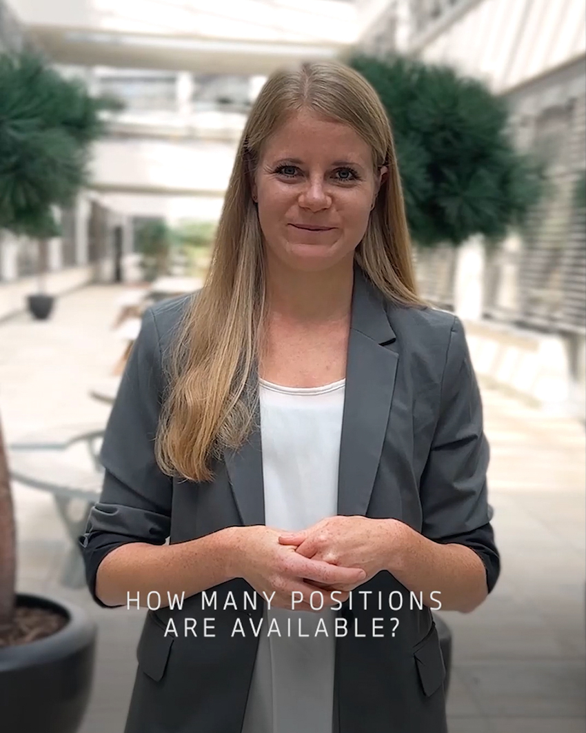 A female trainee answering the question "how many positions are available?'