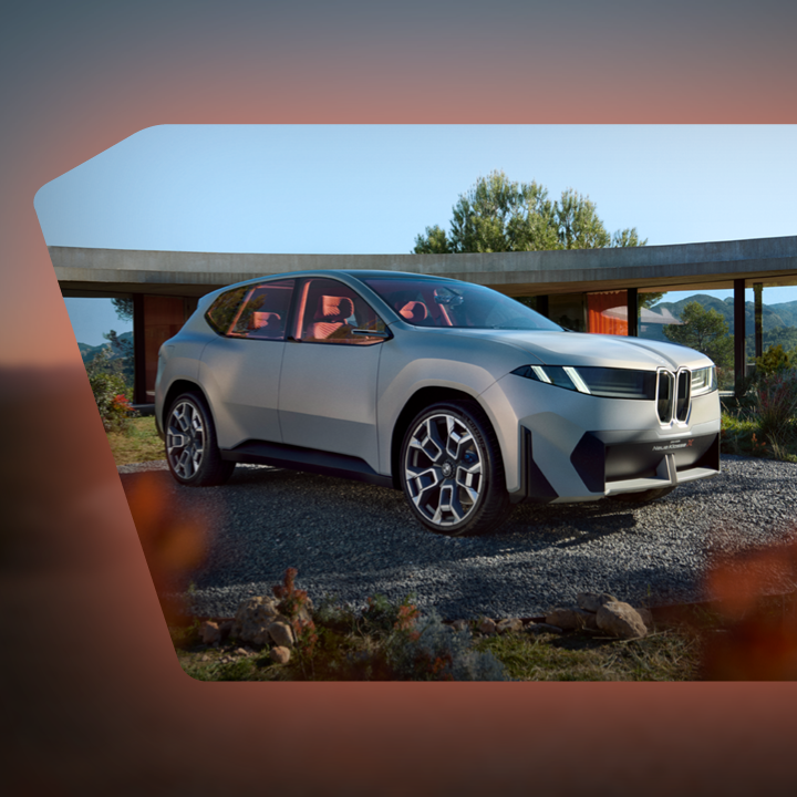 BMW "Neue Klasse" Fahrzeug in der Natur mit dem Slogan "Driving the Next Era".