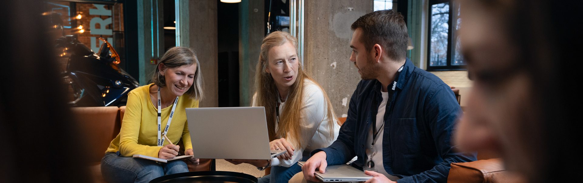 Three colleagues having a conversation