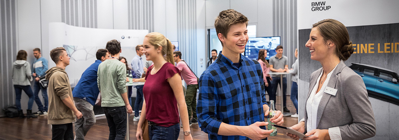A crowd of people at a BMW Group Pupil event. 