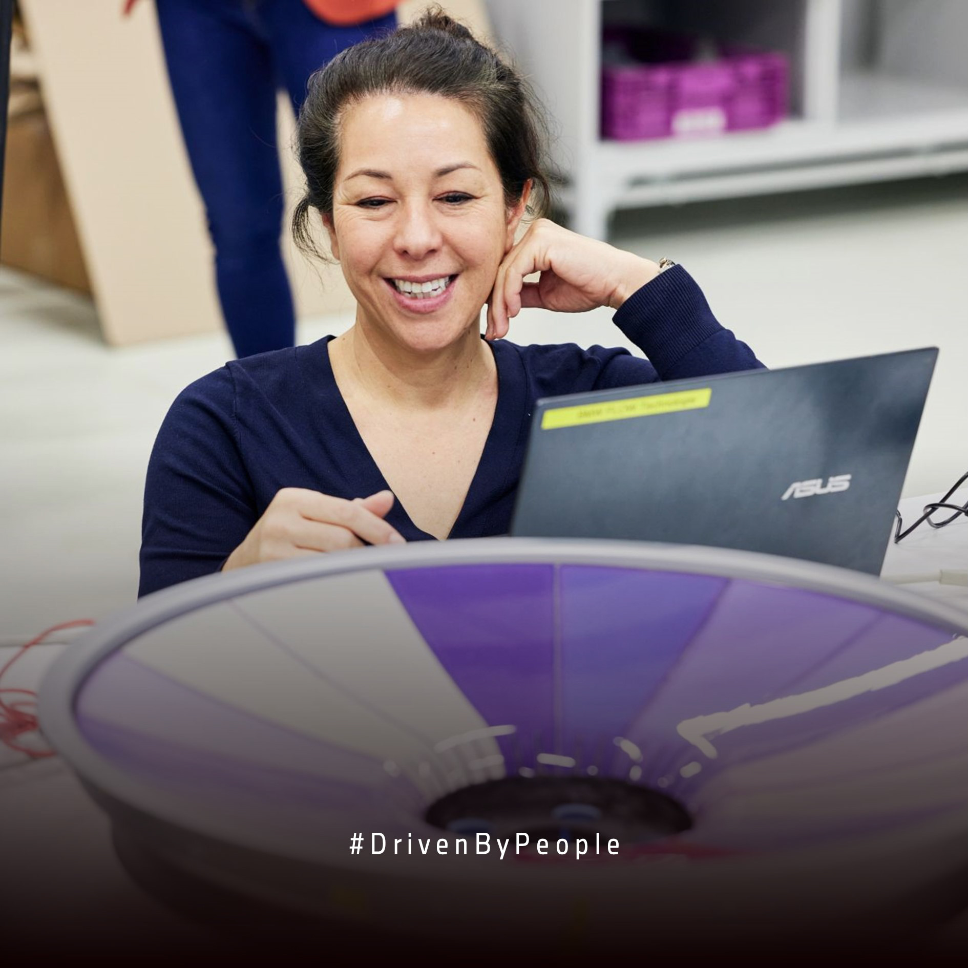 Portrait of  a female engineer in a frame of rainbow colours.