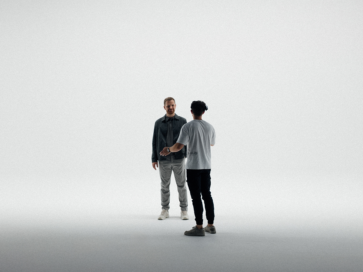 Designer Anders in a conversation with a photographer, behind-the-scenes material