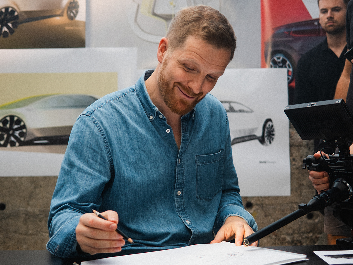 Designer Anders working on sketchings, behind-the-scenes material