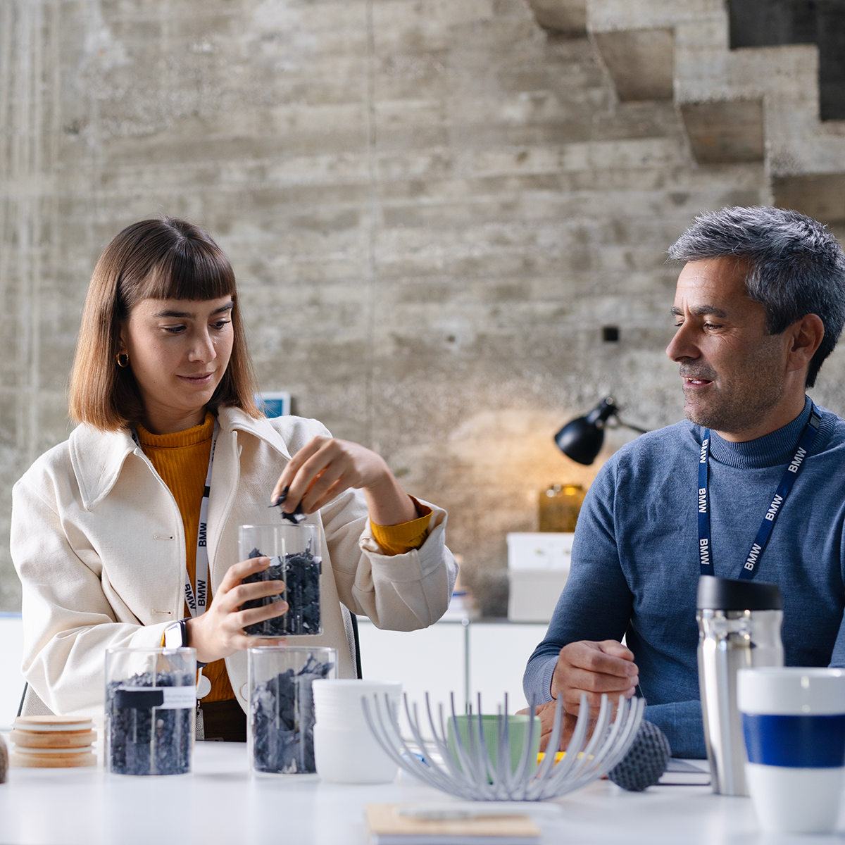 Two colleagues in sustainability talking about new materials they could use.