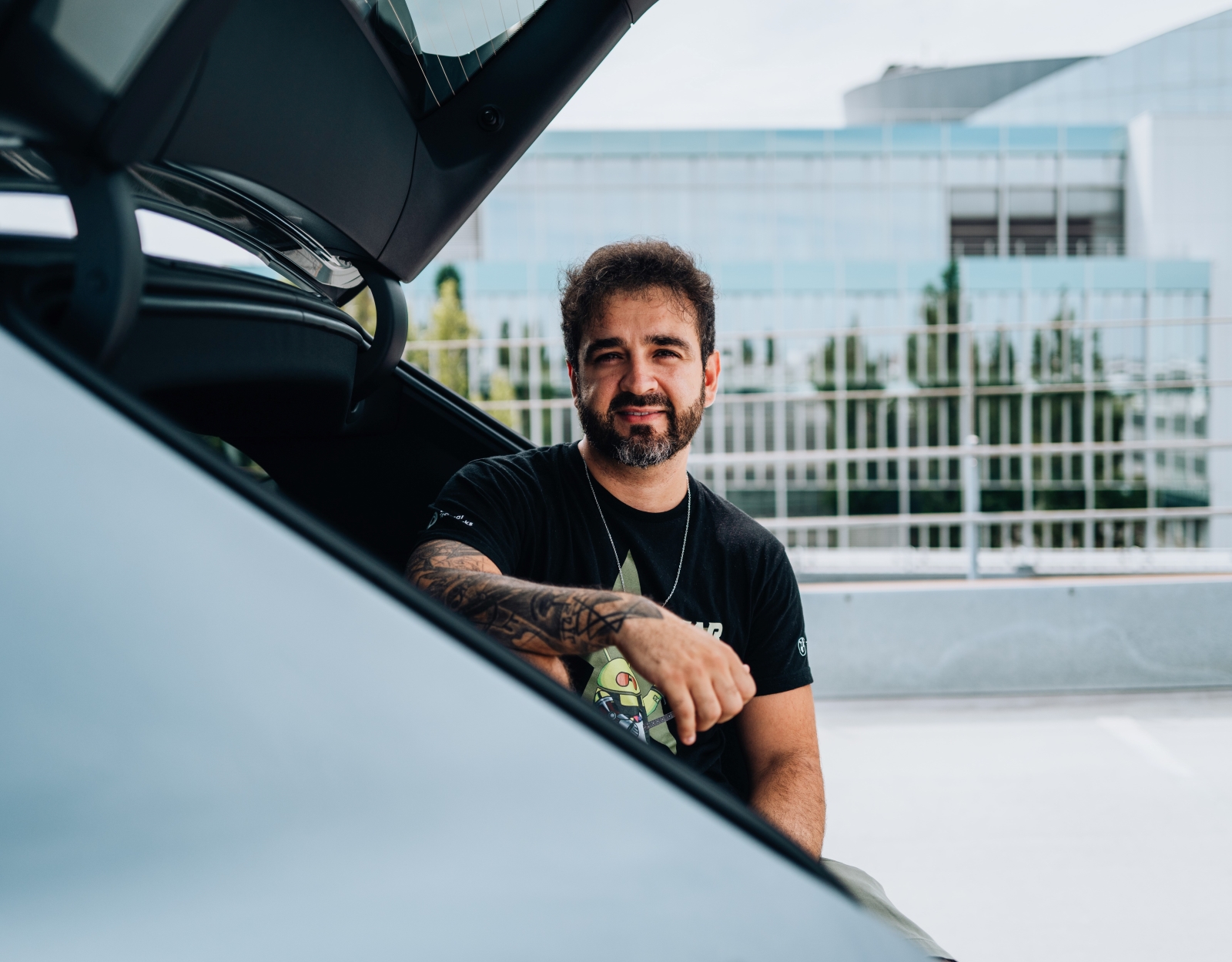 BMW software architect Matheus in the trunk of a BMW iX3