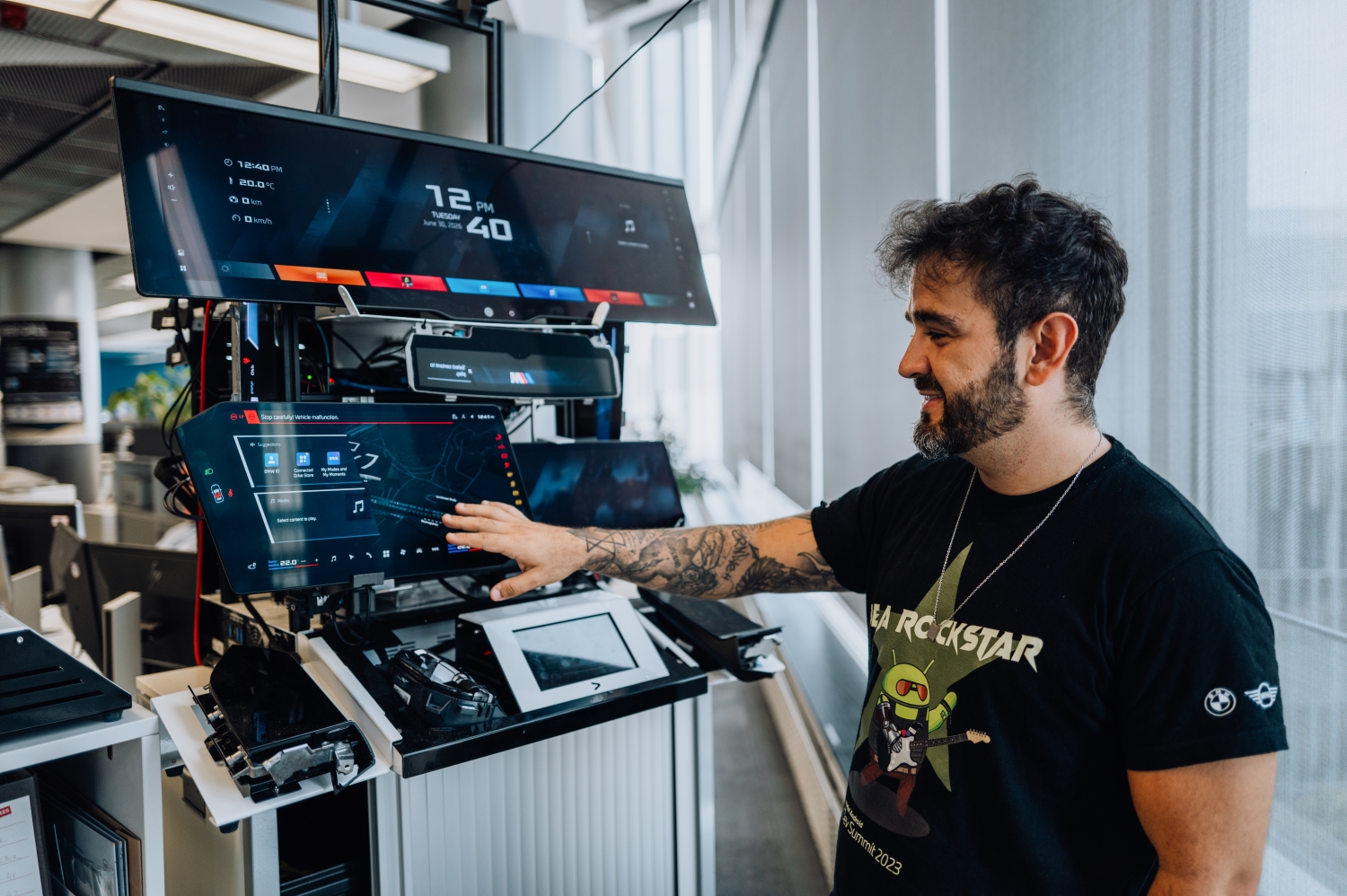BMW software architect Matheus in front of a testrack