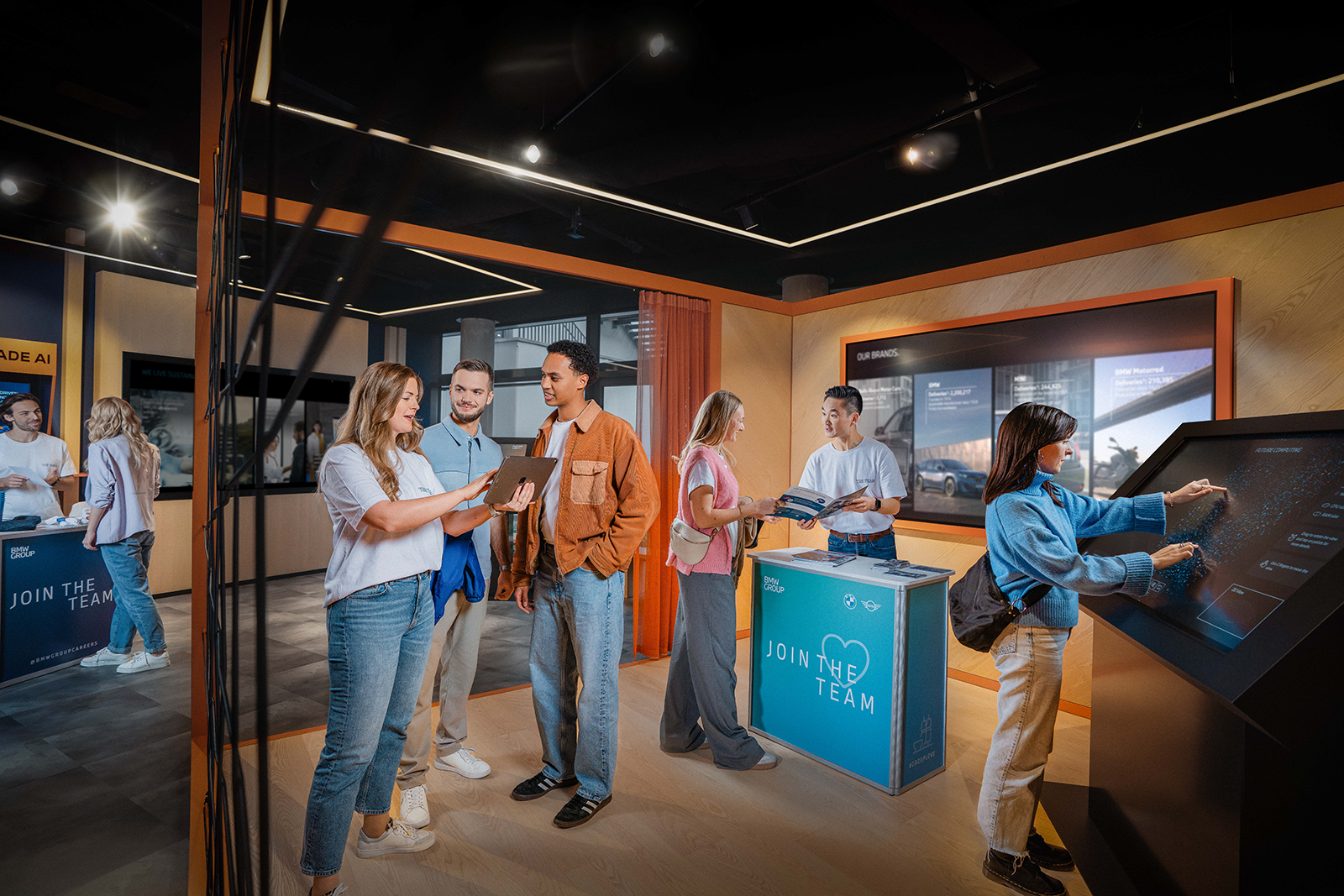 Young people engaging at a BMW Group event for students.