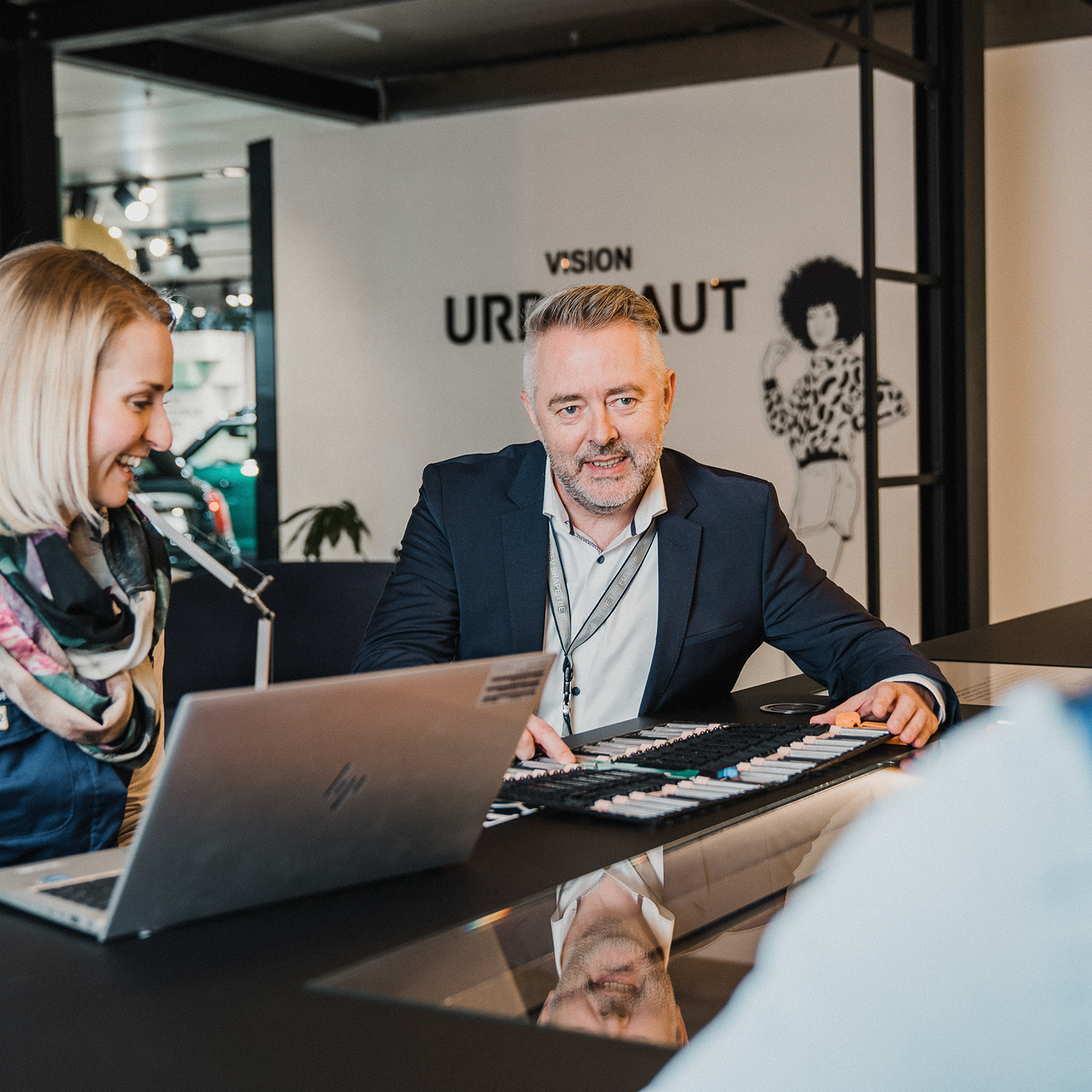 BMW purchasing employees in a meeting with a supplier discussing collaboration. 