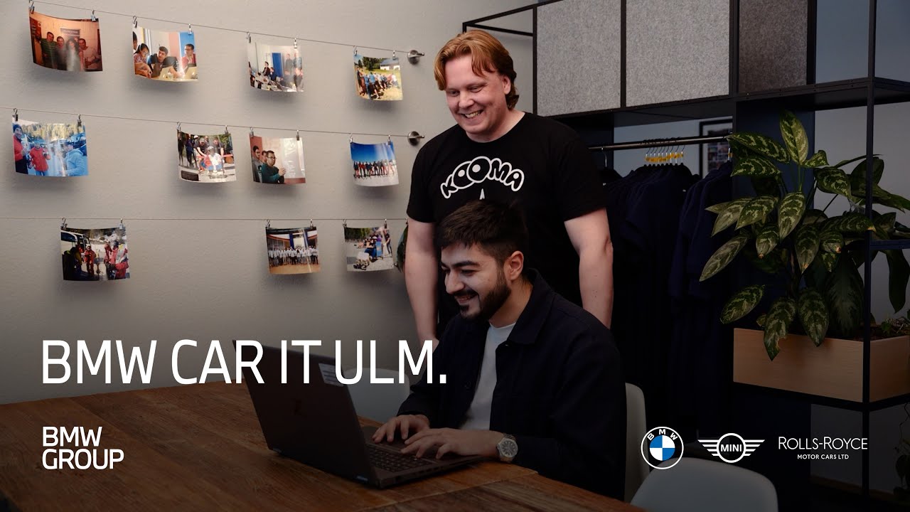 Man sitting in a BMW vehicle. Insights into working at the BMW Car IT in Ulm..