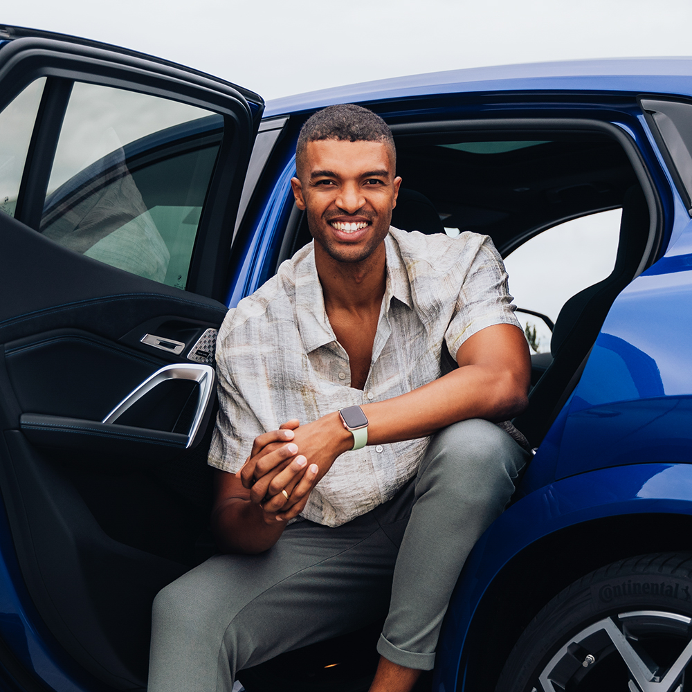 Engineer Marvin in a blue BMW X2