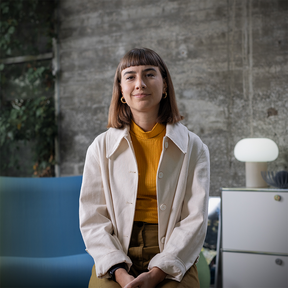 Anna, Specialist Sustainability in the Supply Chain, in a modern office setting