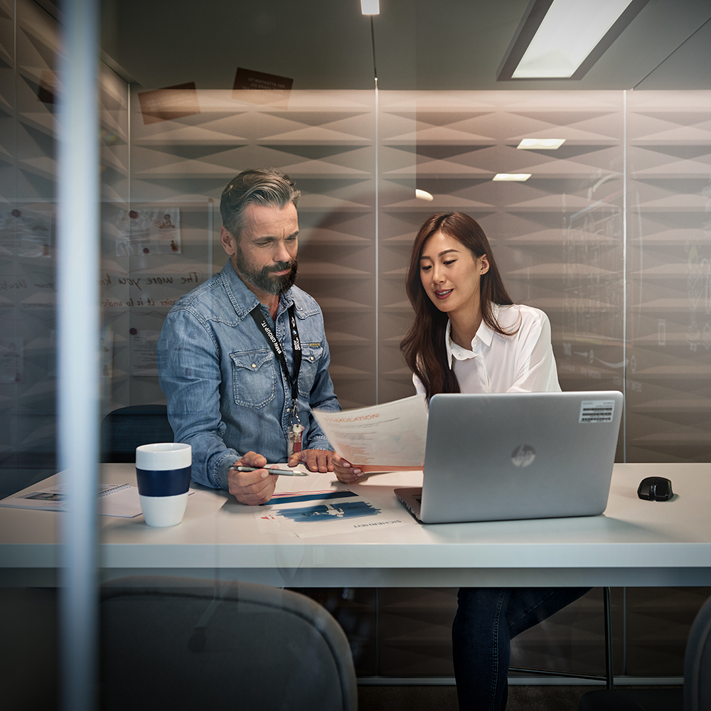 An intern with her supervisor in a meeting situation