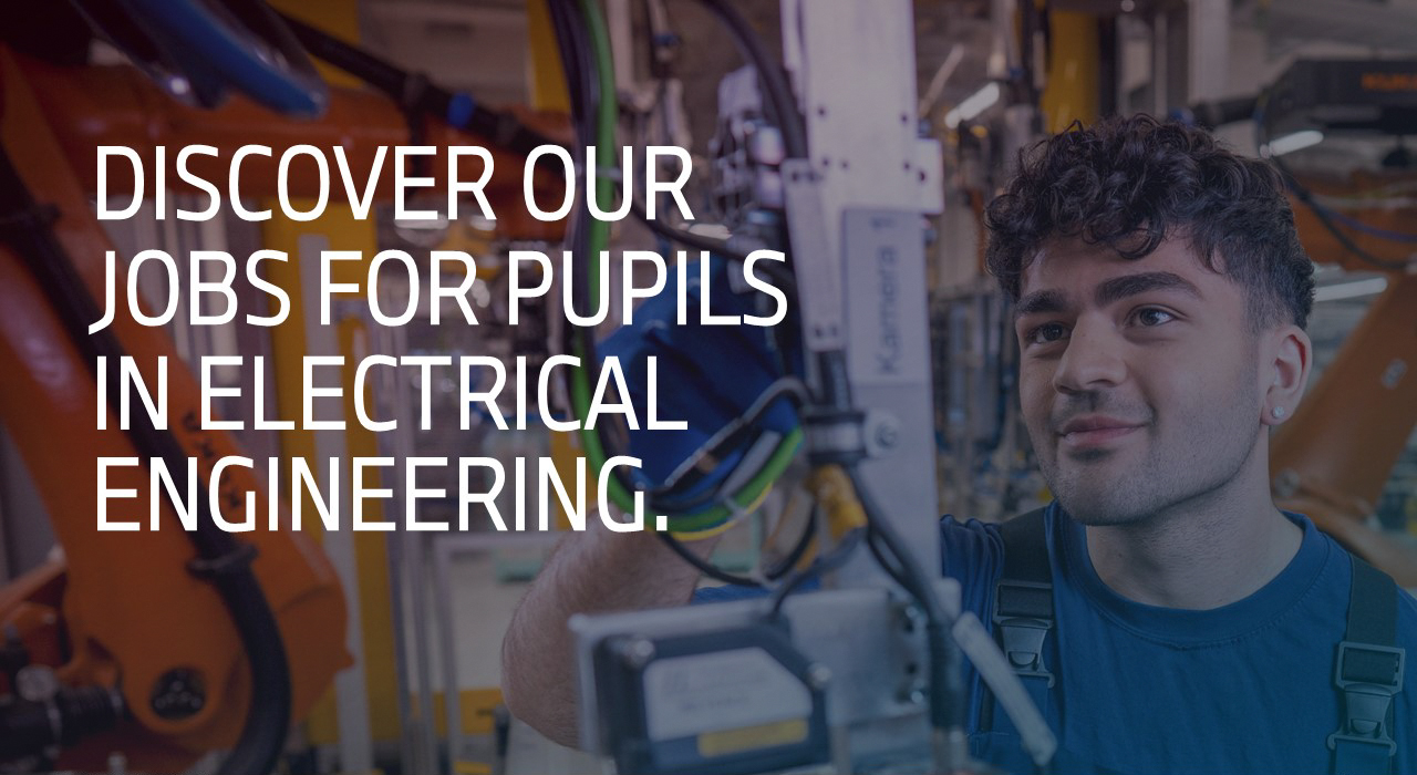 A young man exploring career opportunities in electrical engineering, surrounded by advanced technology.