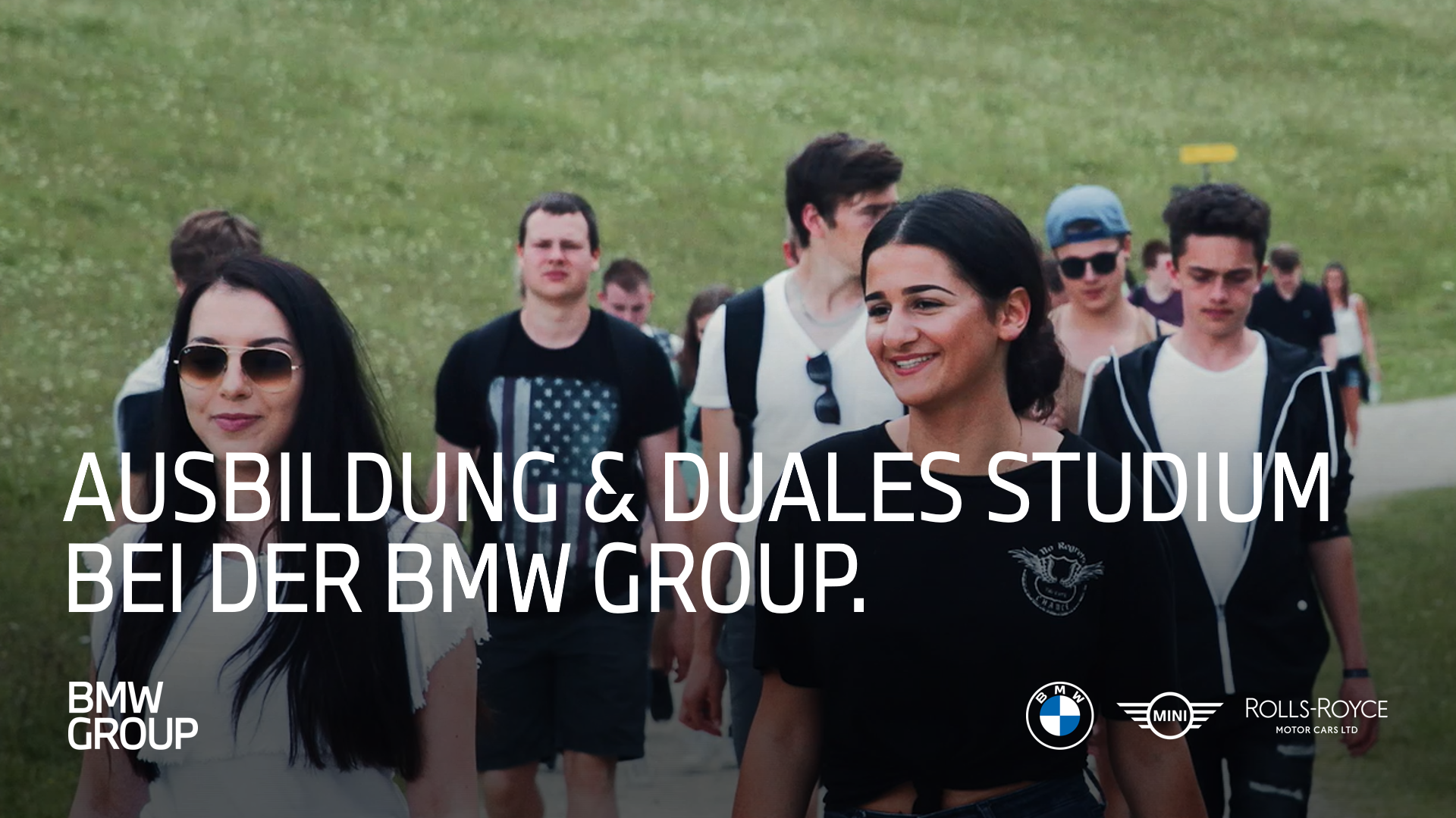 Young individuals walking together as part of the BMW Group education initiative.