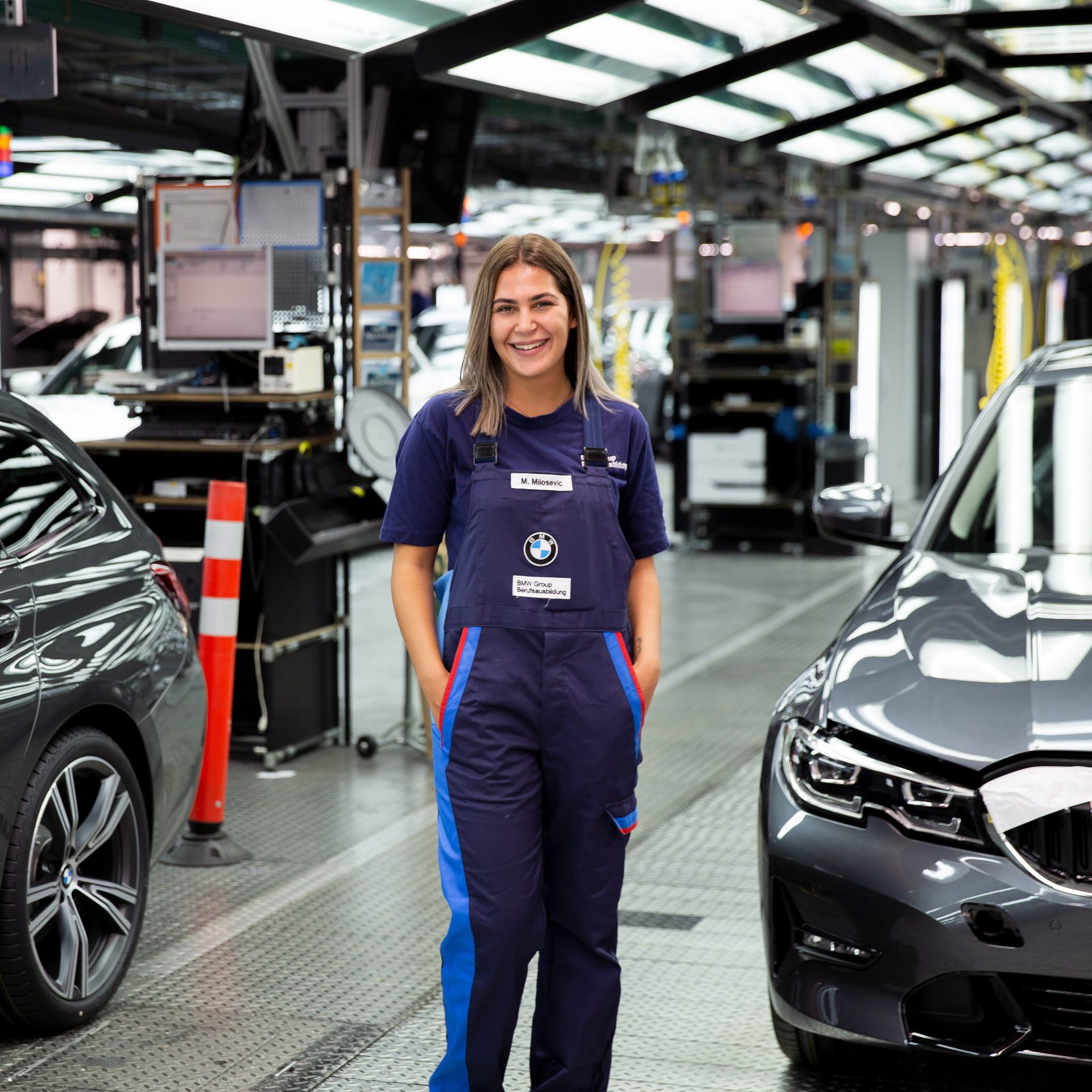 The picture shows a production mechanics apprentice at BMW.