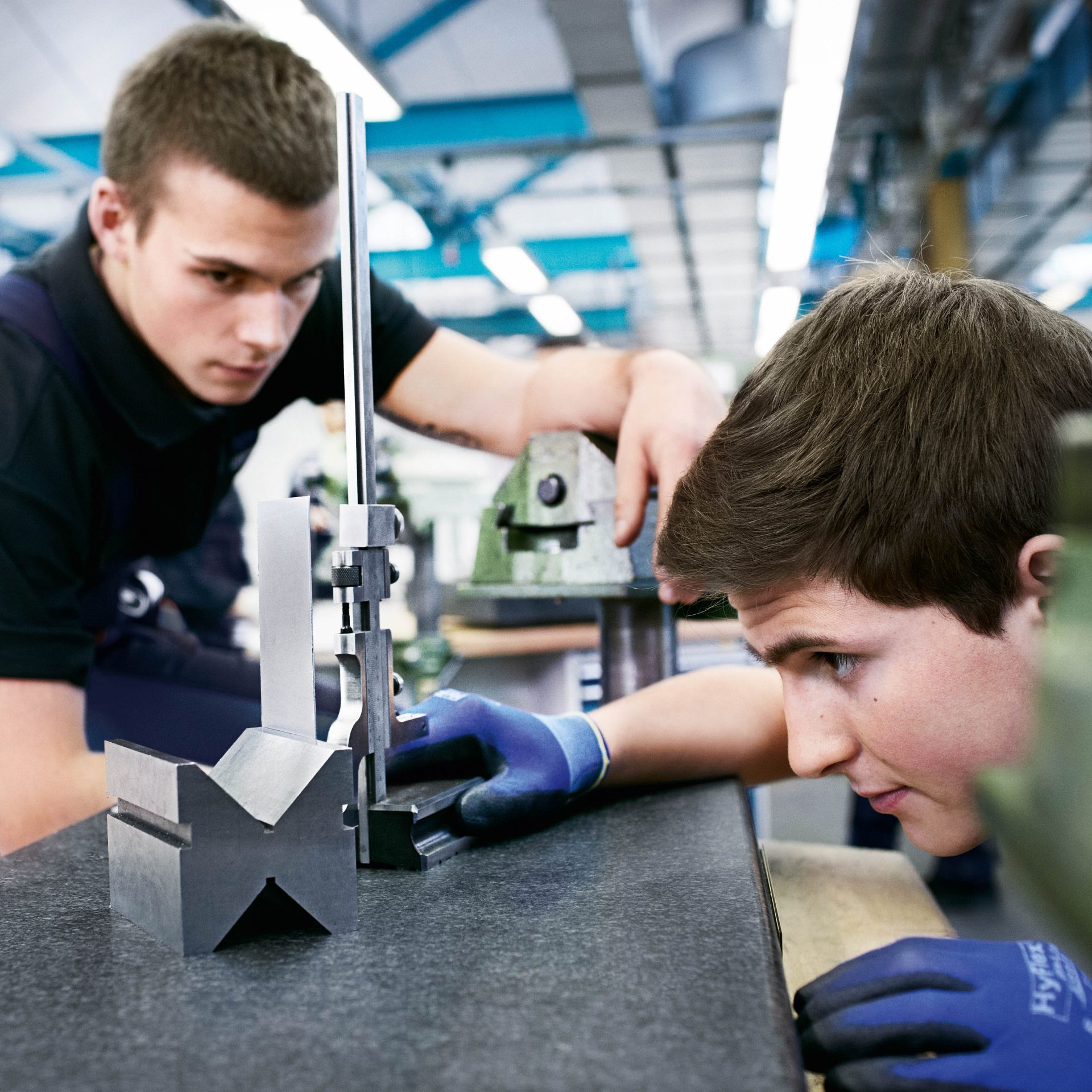 Two apprentices doing a task during their apprenticeship.