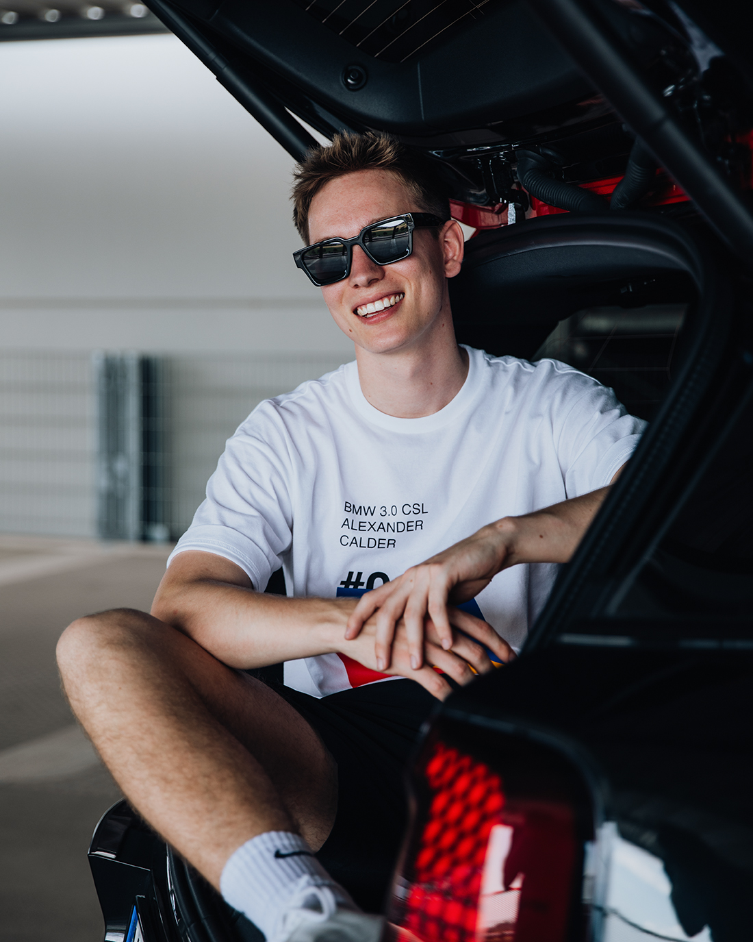 Fastlane Student sitting in the trunk of a MINI Countryman.