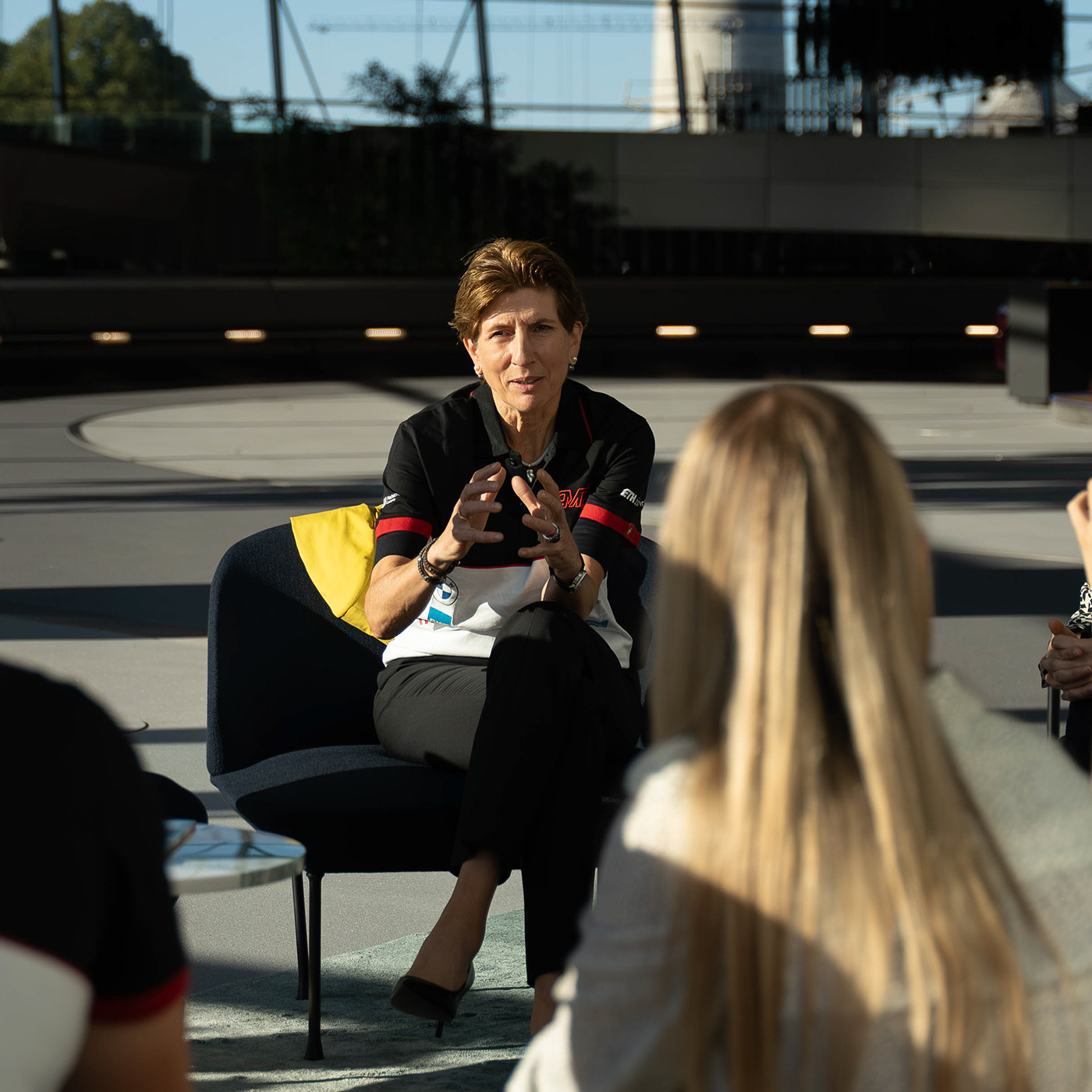 Ilka Horstmeier in conversation with students involved in Formula Student