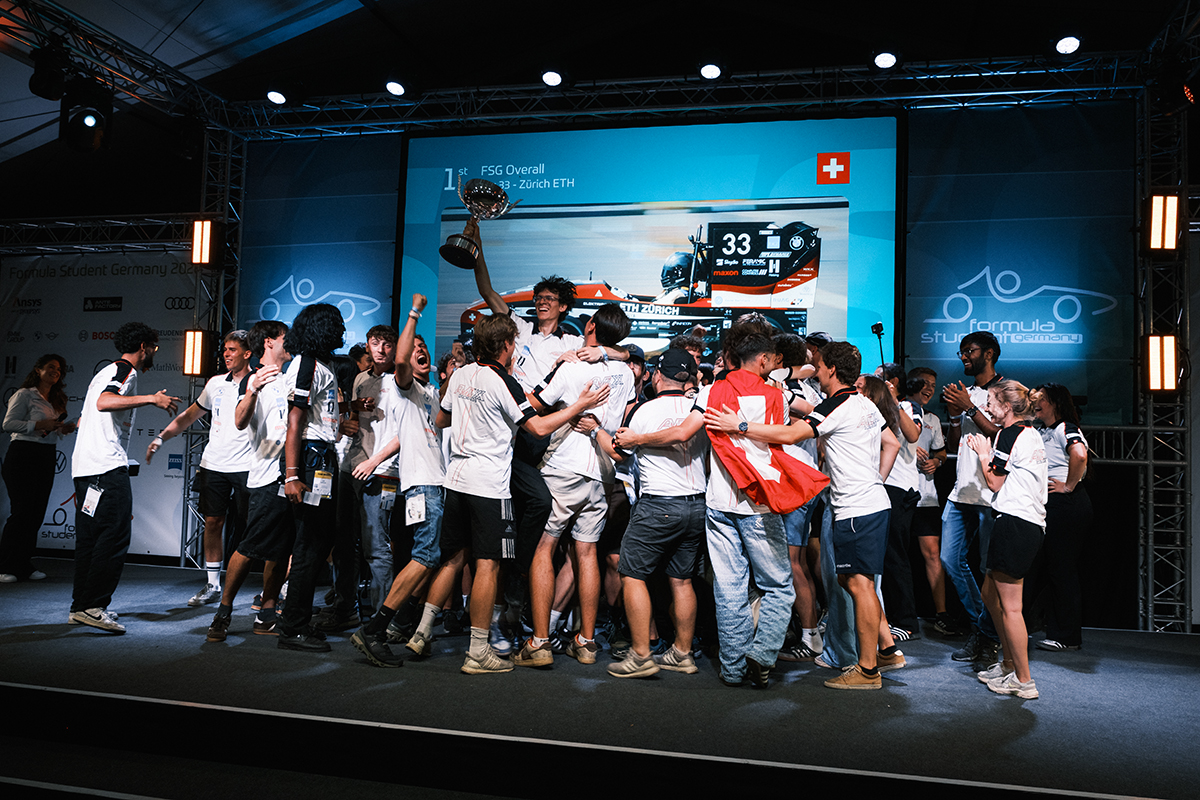 The ETH Zurich Formula Student team celebrates its victory on stage