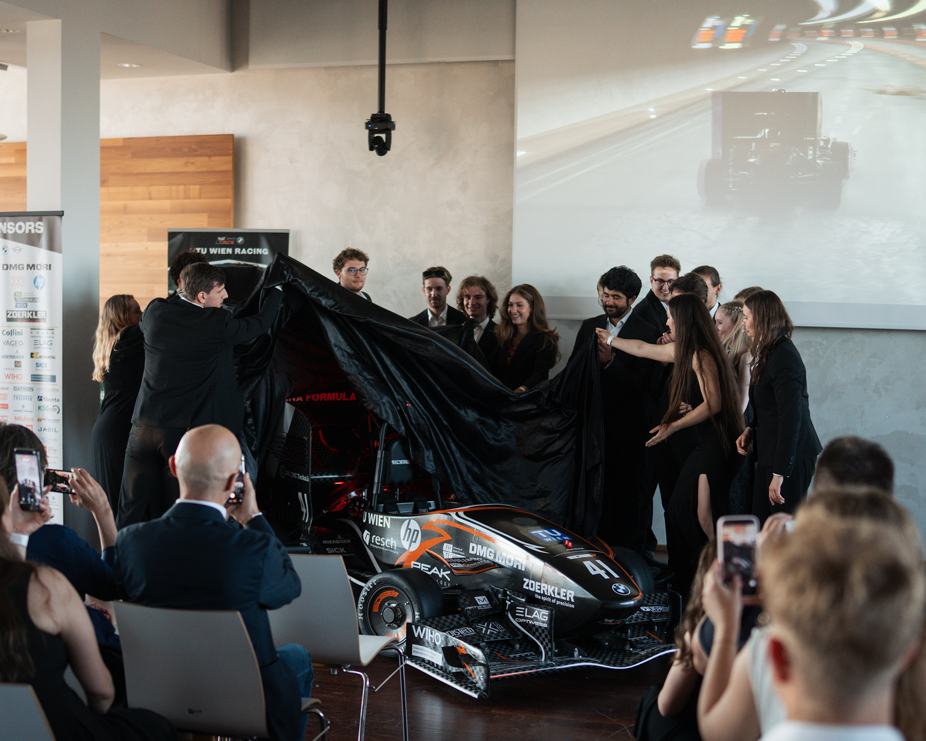  Group photo of TU Wien Racing with the vehicle.