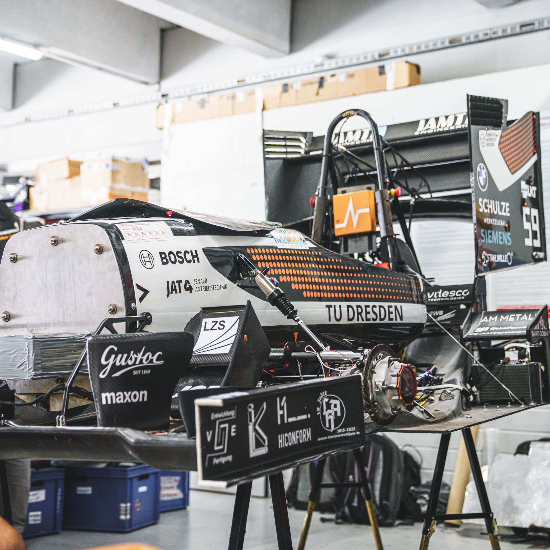 TU Dresden racing car lifted in the air.